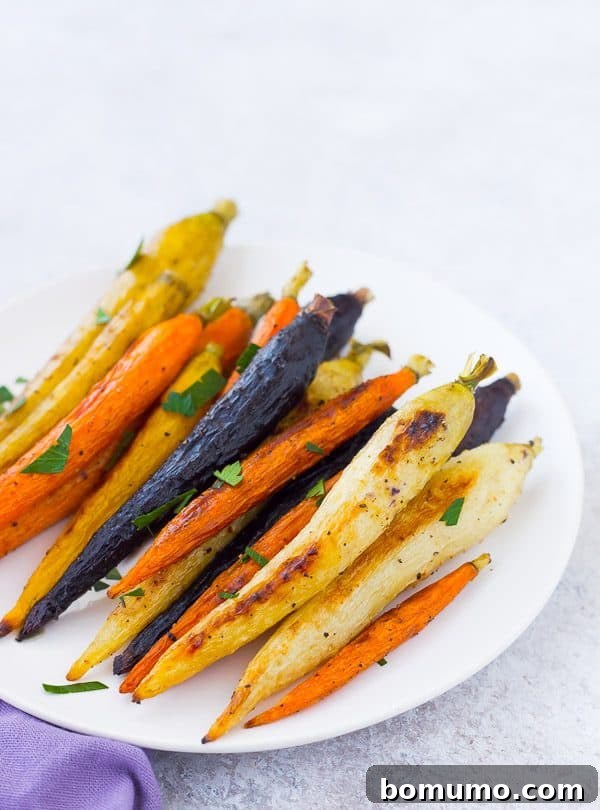 Close-up of perfectly roasted whole carrots, golden brown and tender, ready to serve.