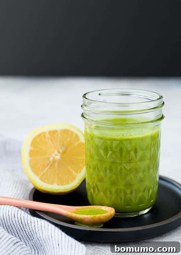This bright and fragrant lemon basil vinaigrette is a perfect healthy homemade salad dressing. It's Whole30 compliant, excellent on green salads or pasta salads, and fantastic drizzled over grilled chicken, enhancing any meal with its fresh, zesty flavor.