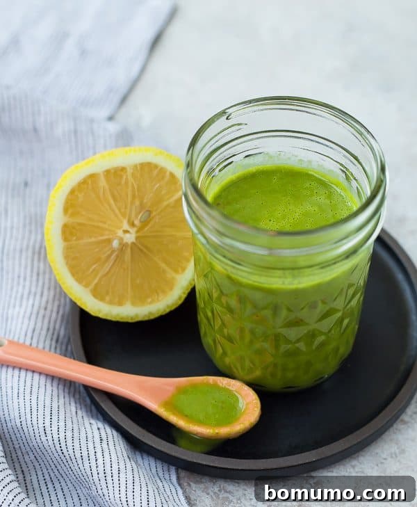 This bright and fragrant lemon basil vinaigrette dressing is the perfect healthy salad dressing. It's Whole30 compliant and is a great addition to a green tossed salad or a pasta salad. It's also great drizzled on top of grilled chicken! Get the easy salad dressing recipe on RachelCooks.com!