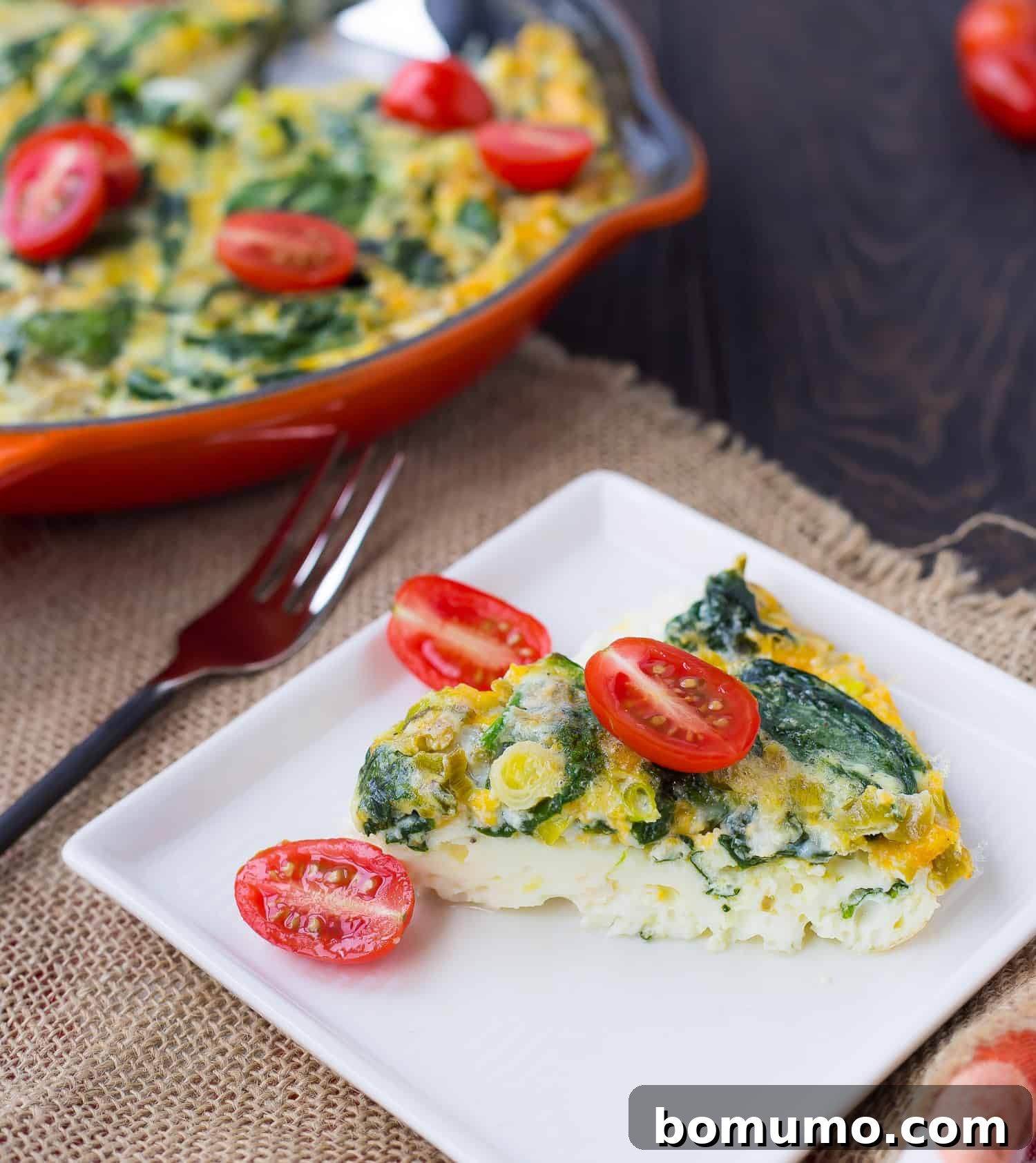 Egg White Chile Frittata 4 A perfectly sliced piece of egg white frittata presented on a clean white plate, ready to be enjoyed.