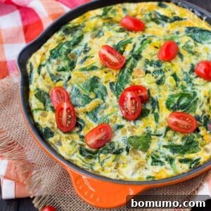Egg white frittata topped with fresh tomatoes.