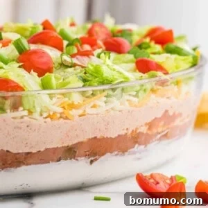 Straight on image of 7 layer dip to show layers in glass dish.