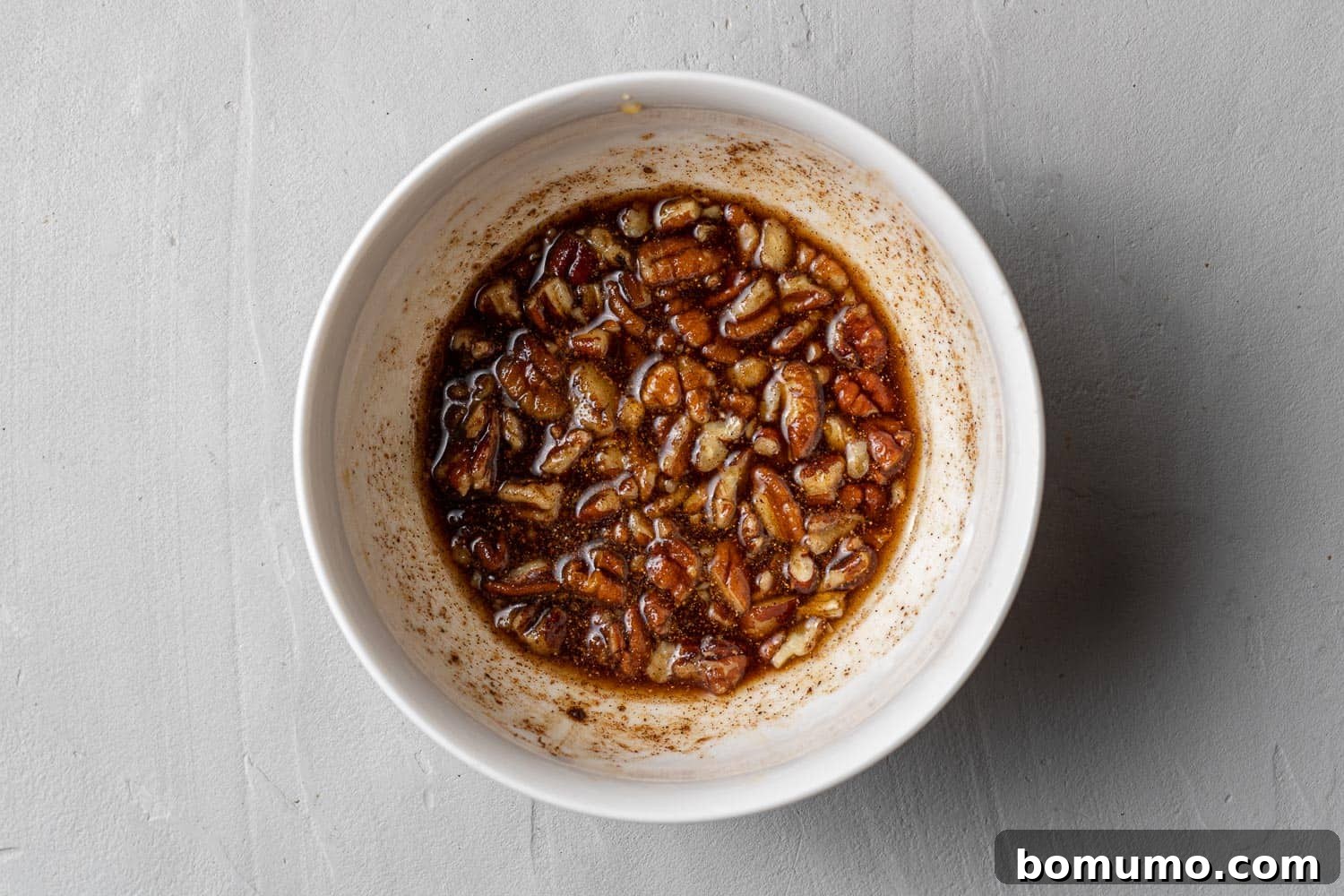 Nuts mixed with bourbon, sugar, and spices.