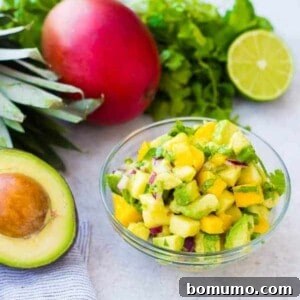 Mango Avocado Salsa, a perfect topping for tacos, salads, or chips, bursting with creamy avocado, sweet mango, and tart pineapple.