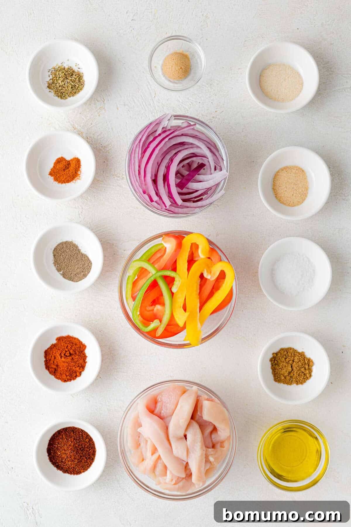Overhead view of all ingredients meticulously laid out for the sheet pan fajita recipe.