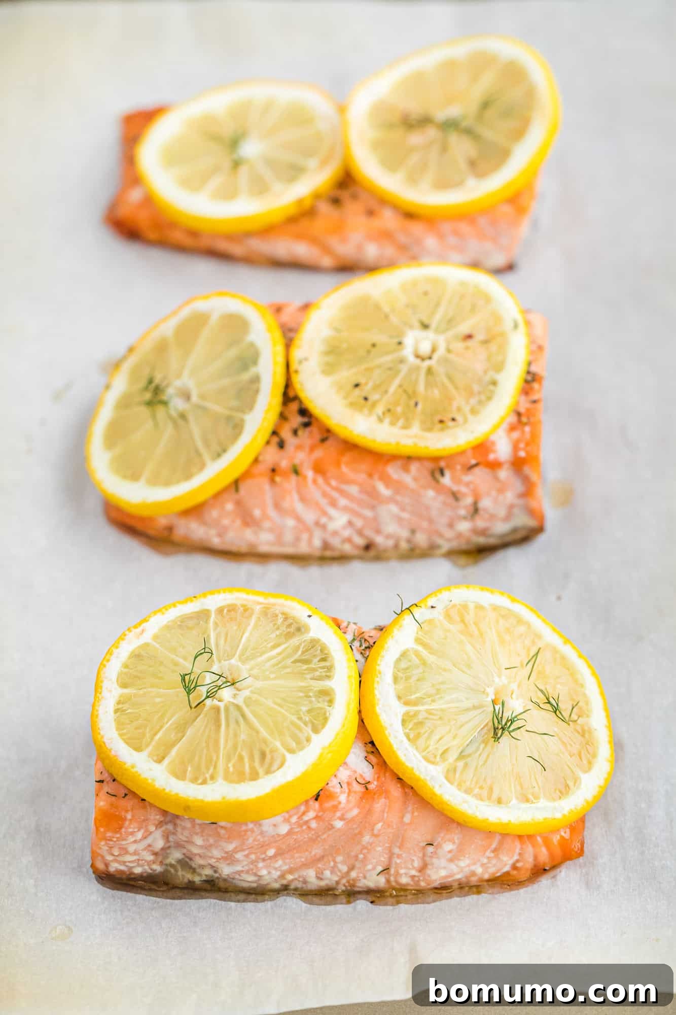 Baked salmon on a sheet pan.