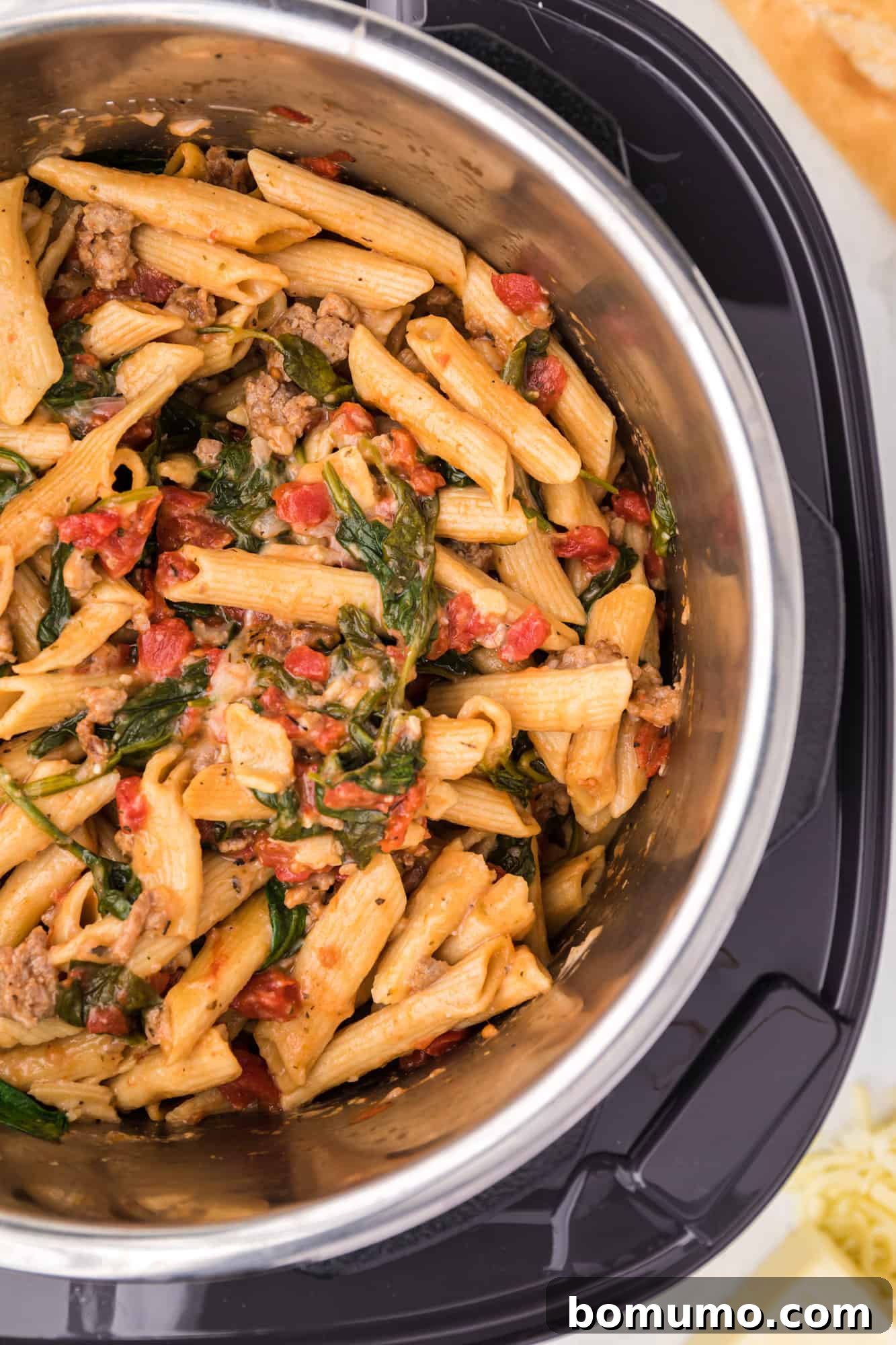 Melted cheese perfectly integrated into the creamy Instant Pot pasta, ready to be served.