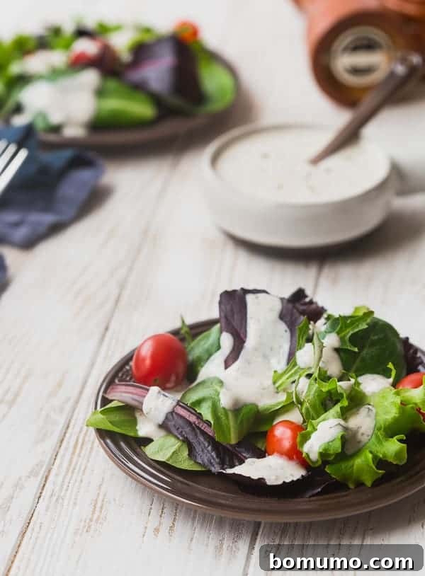 This creamy Parmesan Peppercorn Dressing is the perfect dressing if you love ranch but are looking for something new. It's cheesy with a little spice and it's lightened up with Greek yogurt and buttermilk. You're going to love it!