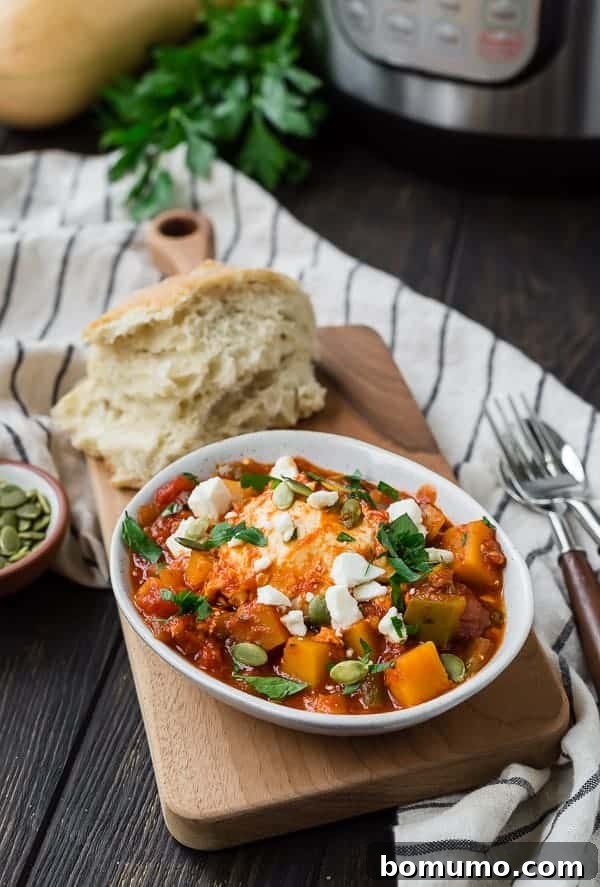 Instant pot shakshuka with bread, parsley, and squash in the background.