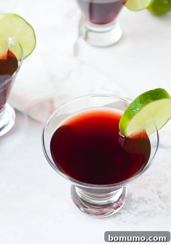 Crimson Bloom Martini 6 A vibrant cherry martini with lime and elderflower, perfectly garnished and ready to be enjoyed. A fruity and easy cocktail for any occasion.