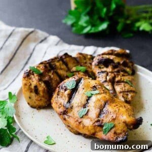 Grilled Chicken Breasts with parsley sprinkled on top, showcasing the delicious result of the honey mustard marinade.