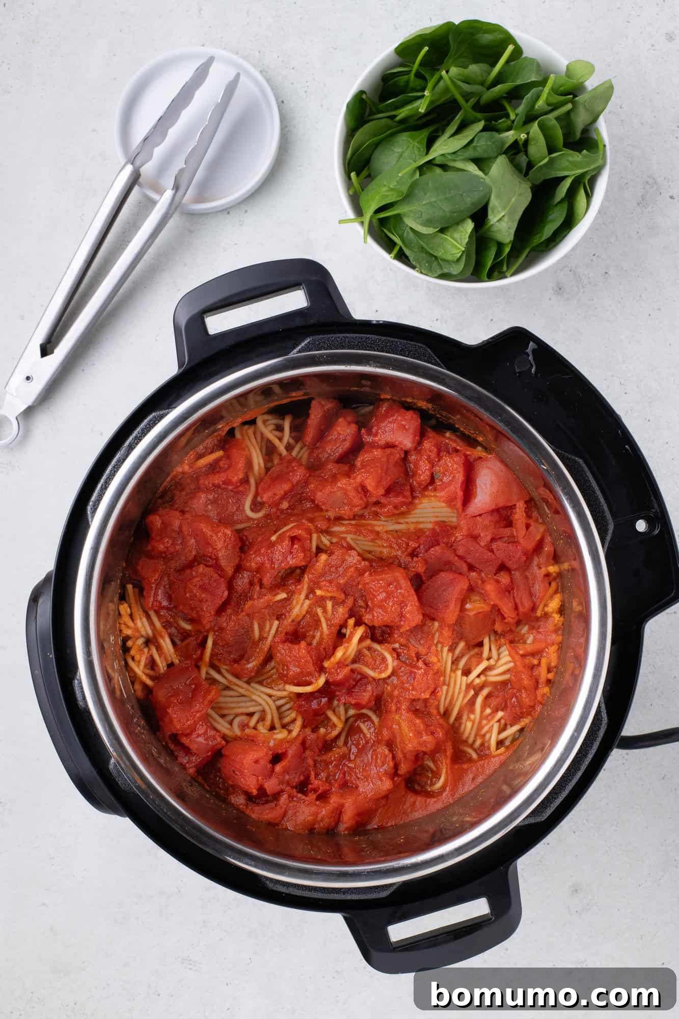 Freshly cooked Instant Pot Spaghetti with meat sauce, perfectly tender and coated in sauce, resting in the inner pot after pressure cooking.