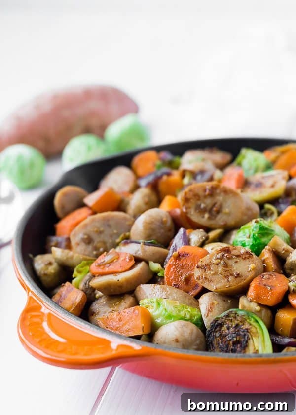 Close-up view of the savory skillet dinner, highlighting the rich colors and textures of the sausage and perfectly cooked vegetables.