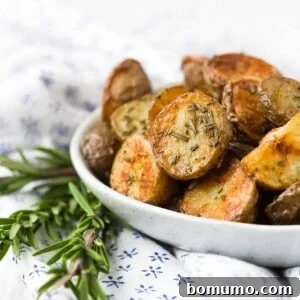 Rosemary roasted potatoes in a small bowl.