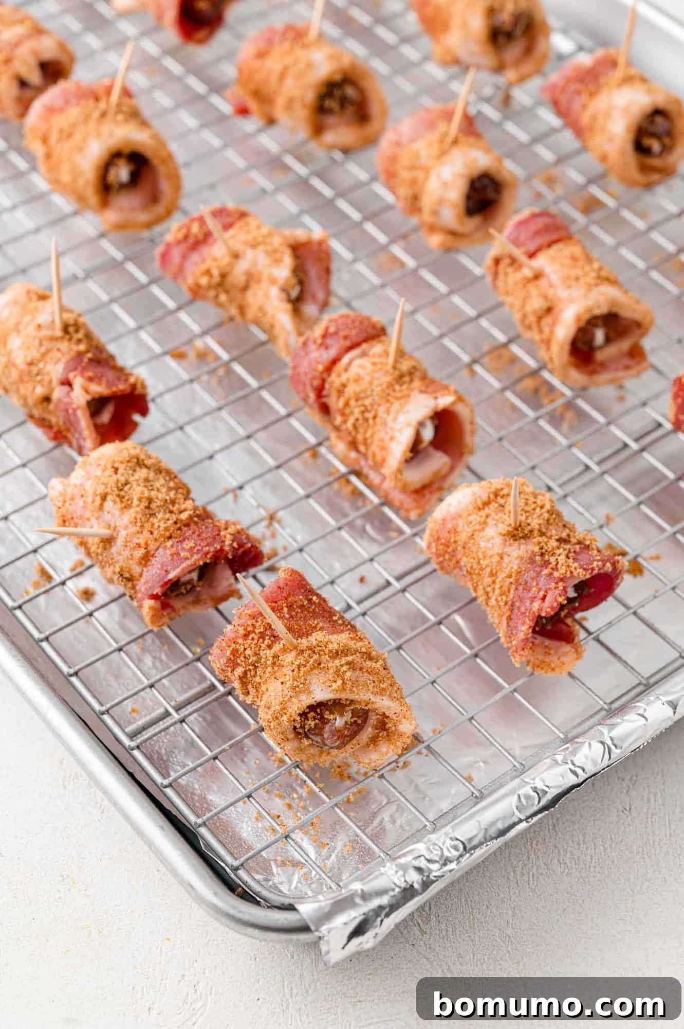 Dates, before baking, on prepared sheet pan.