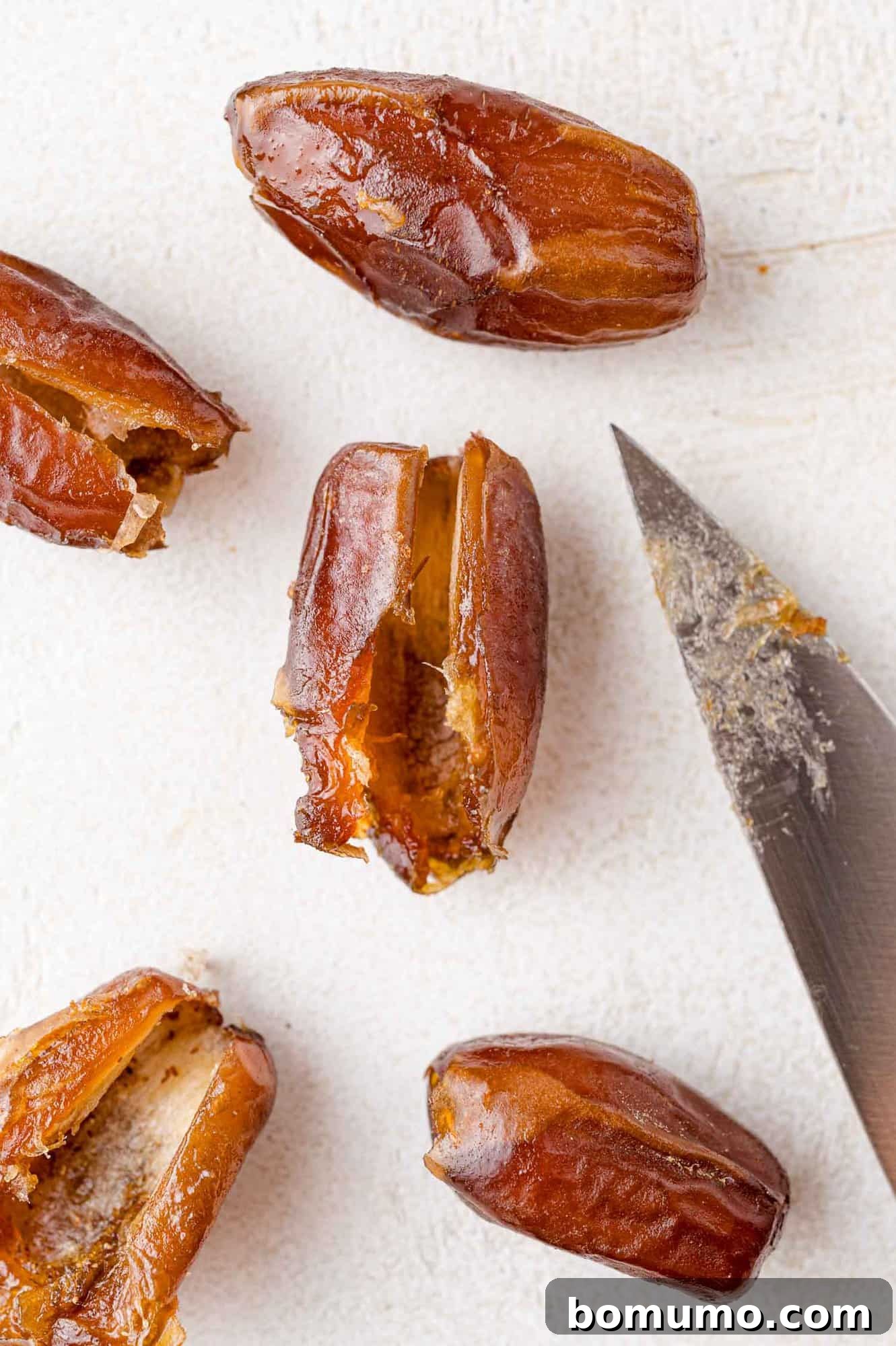 Dates, with slits cut in them.
