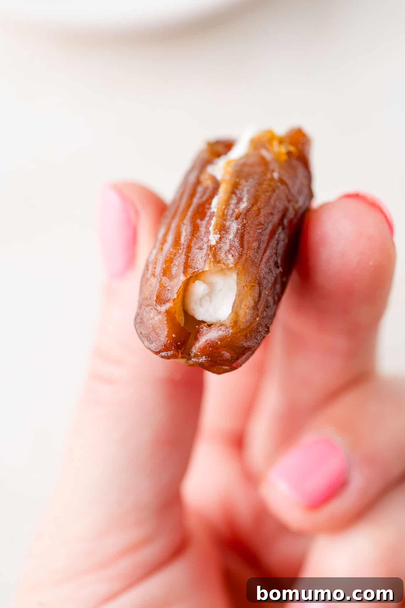 Large date stuffed with goat cheese.