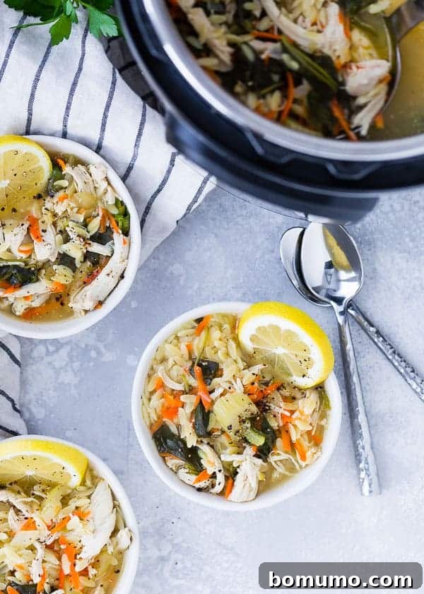 An overhead view of bowls filled with lemon chicken orzo soup, with a steaming Instant Pot of soup in the background, showcasing both serving and cooking vessels.
