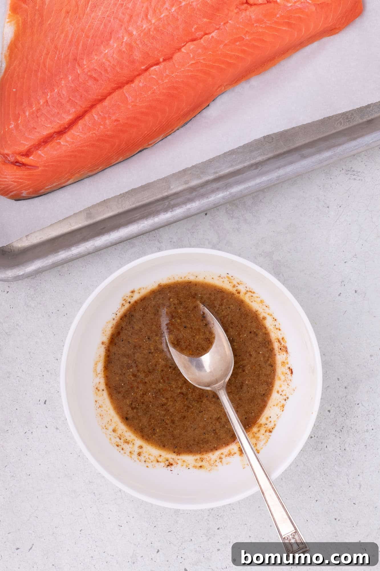 Glaze mixed together in a small white bowl, showing its smooth consistency.