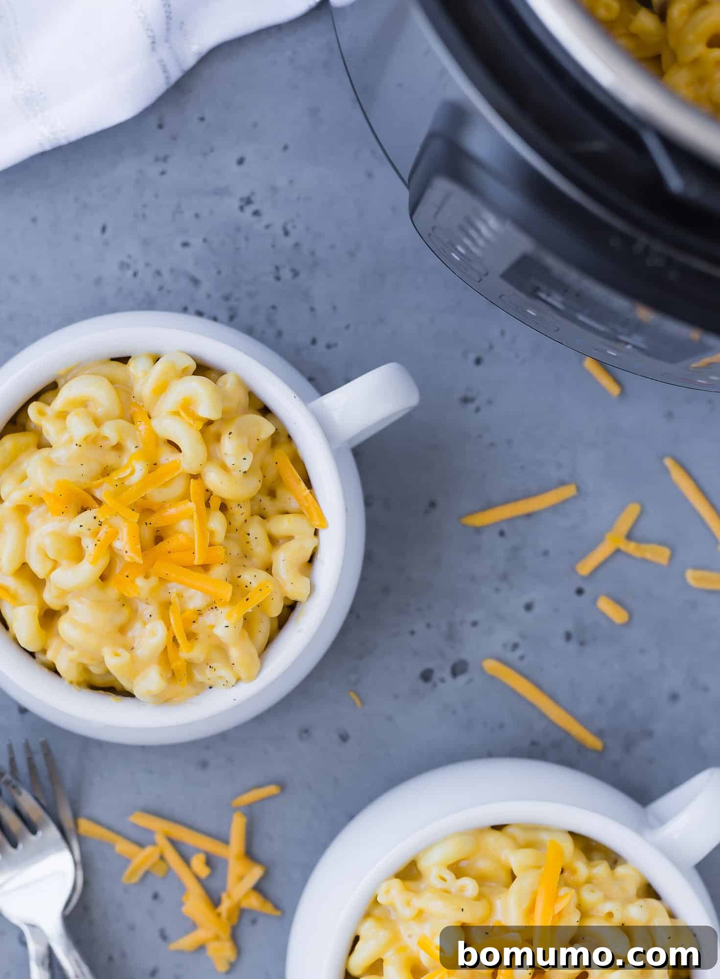 Macaroni and cheese and an Instant pot, overhead view.