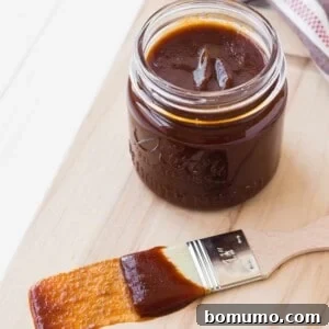 BBQ sauce in a jar and on a brush.
