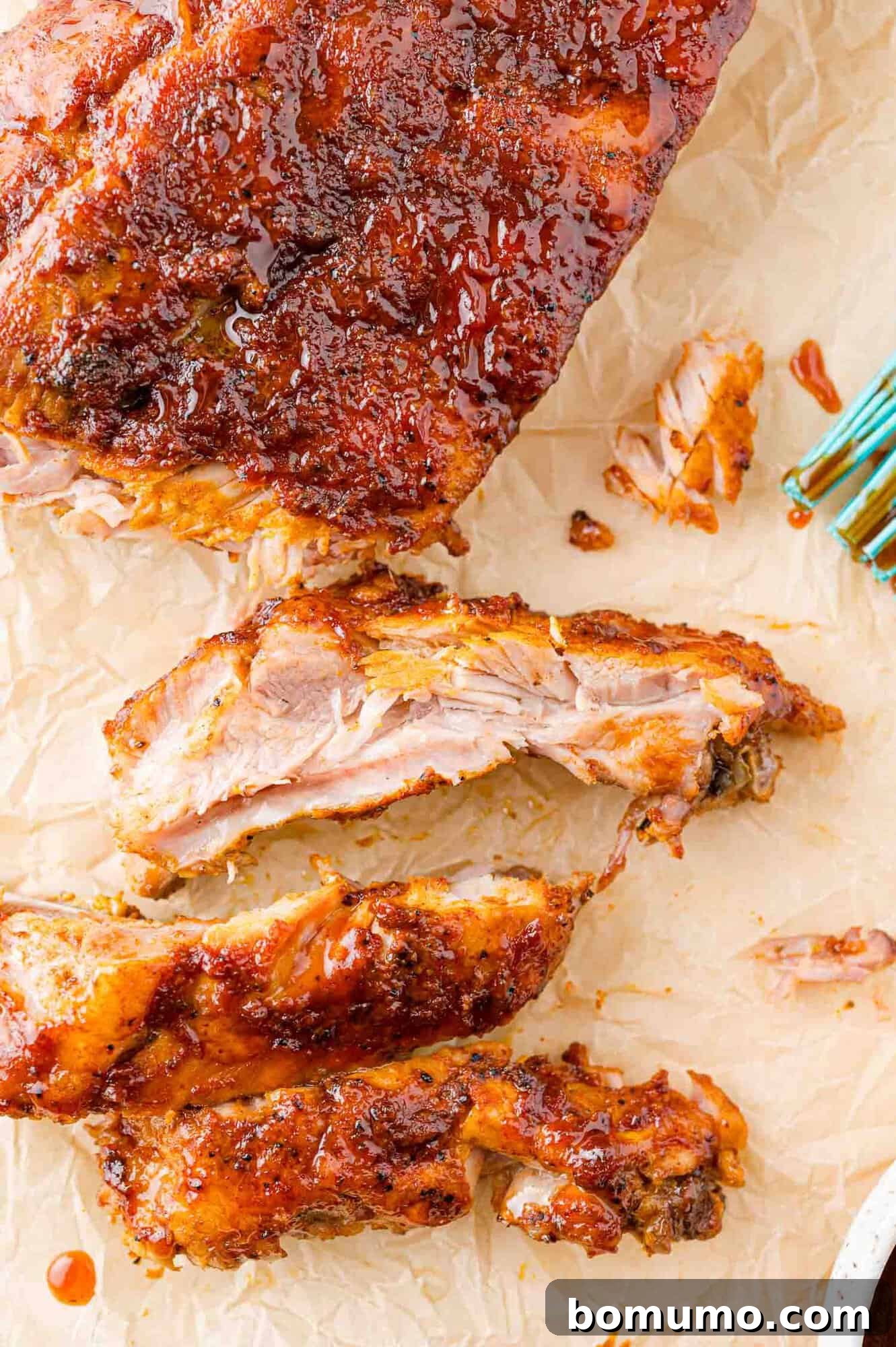 Instant Pot Ribs: Quick & Delicious 12 Rack of barbecue ribs, partially cut.
