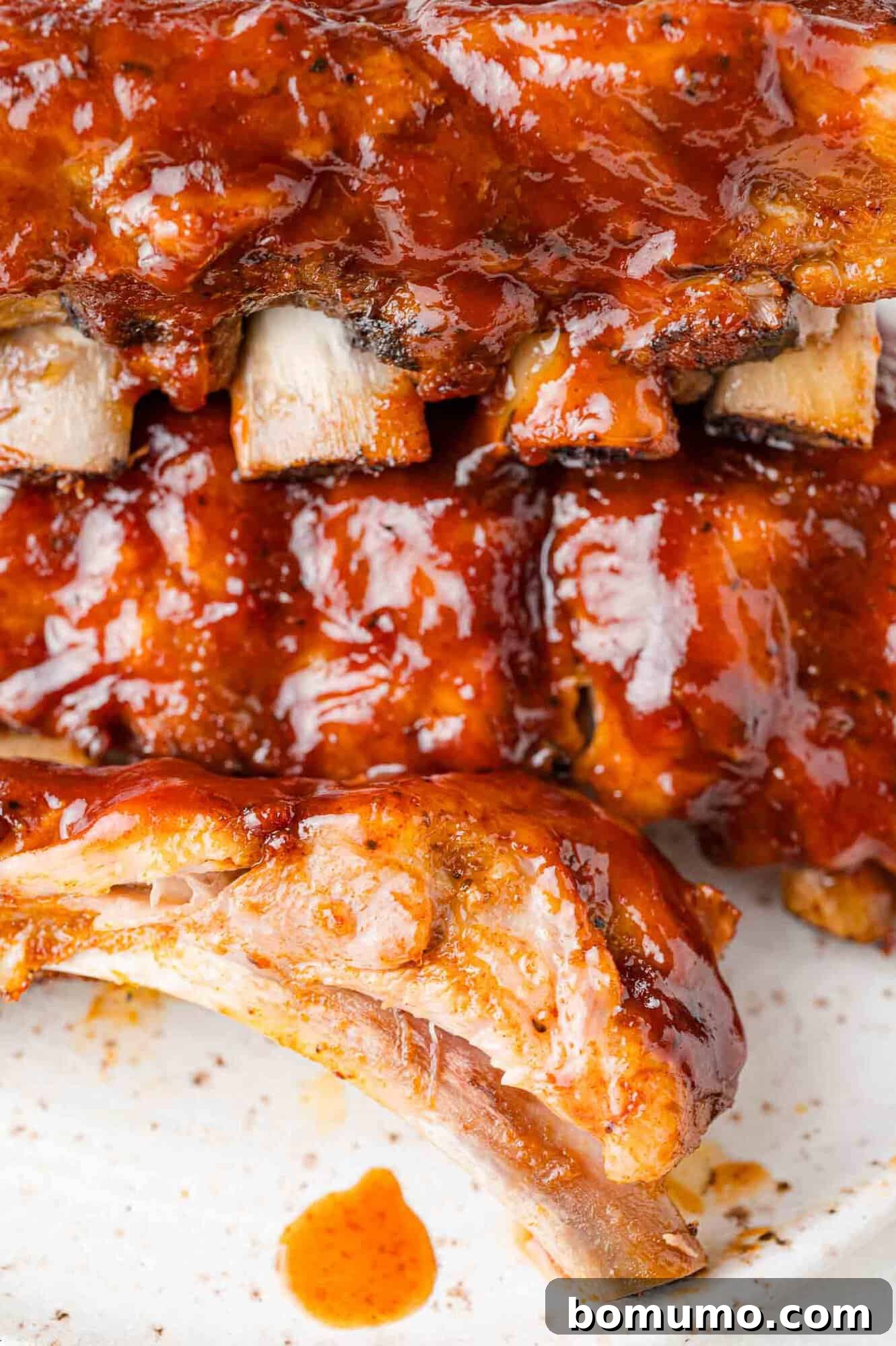 Instant Pot Ribs: Quick & Delicious 13 Cooked ribs, some cut to show texture.
