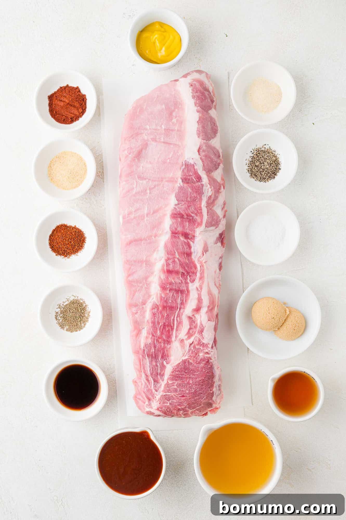 Instant Pot Ribs: Quick & Delicious 3 Ingredients needed to make Instant Pot ribs, including a rack of ribs and spices.