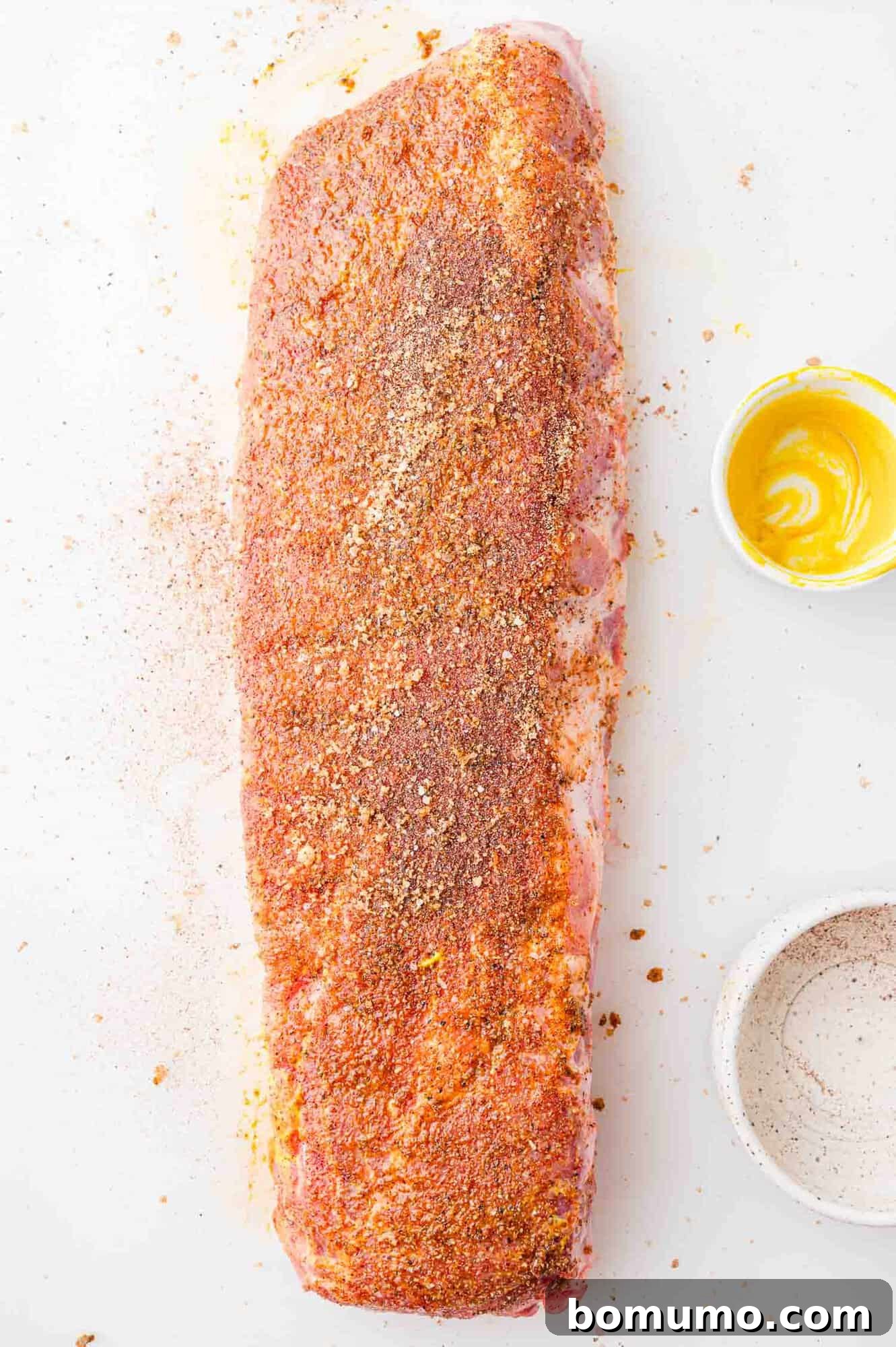 Instant Pot Ribs: Quick & Delicious 8 Uncooked rack of ribs, rubbed with mustard and spice rub.
