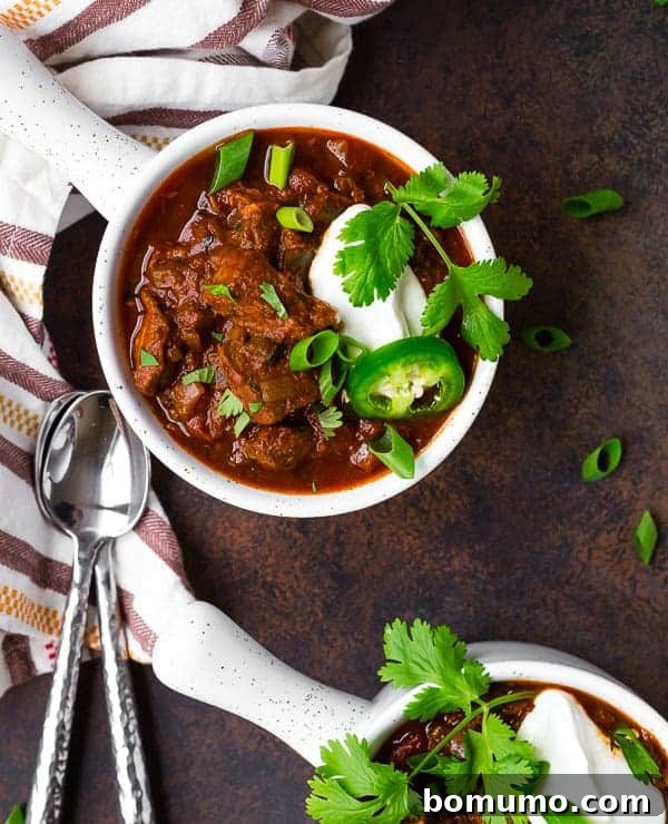 Overhead of chili in serving bowls.