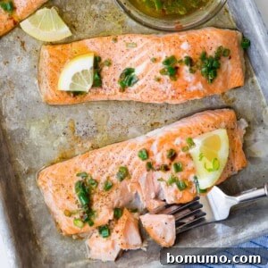Easy baked salmon with lemon and chives, perfectly cooked on a sheet pan.