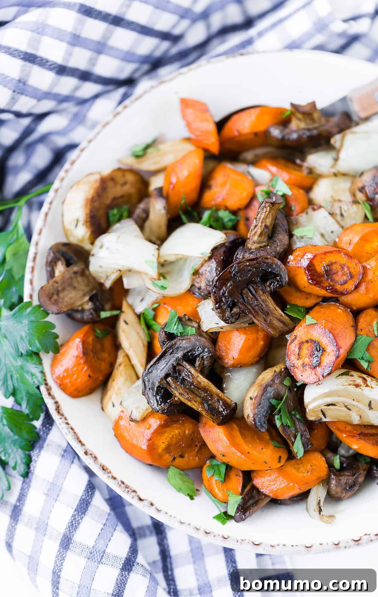 Golden Balsamic Roasts 2 Balsamic roasted vegetables in a bowl, garnished with parsley.