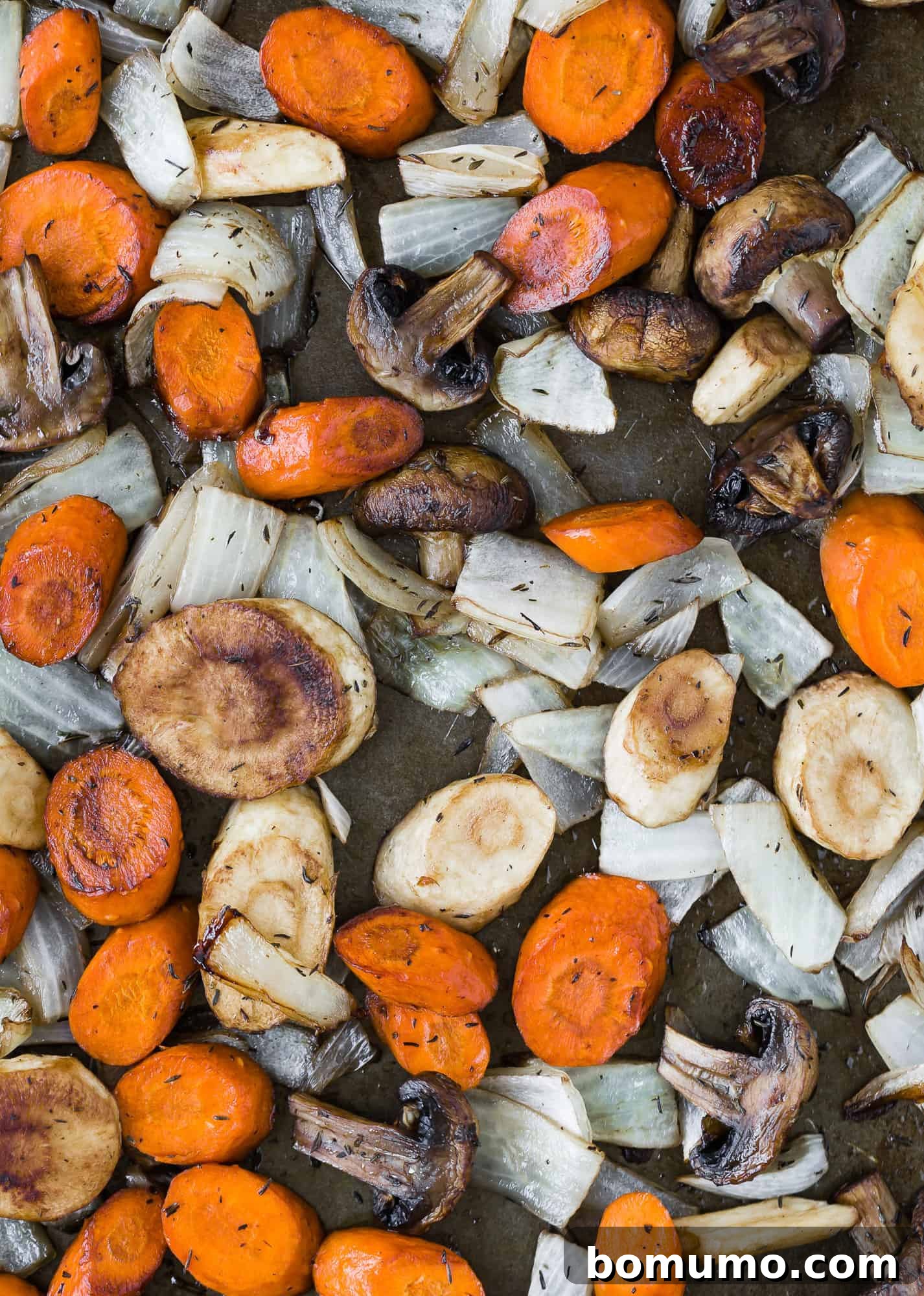 Golden Balsamic Roasts 3 Roasted vegetables on a sheet pan.