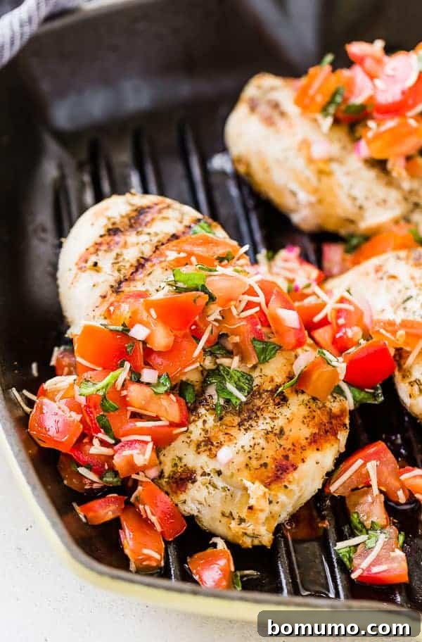 Partial image of bruschetta chicken in grill pan.