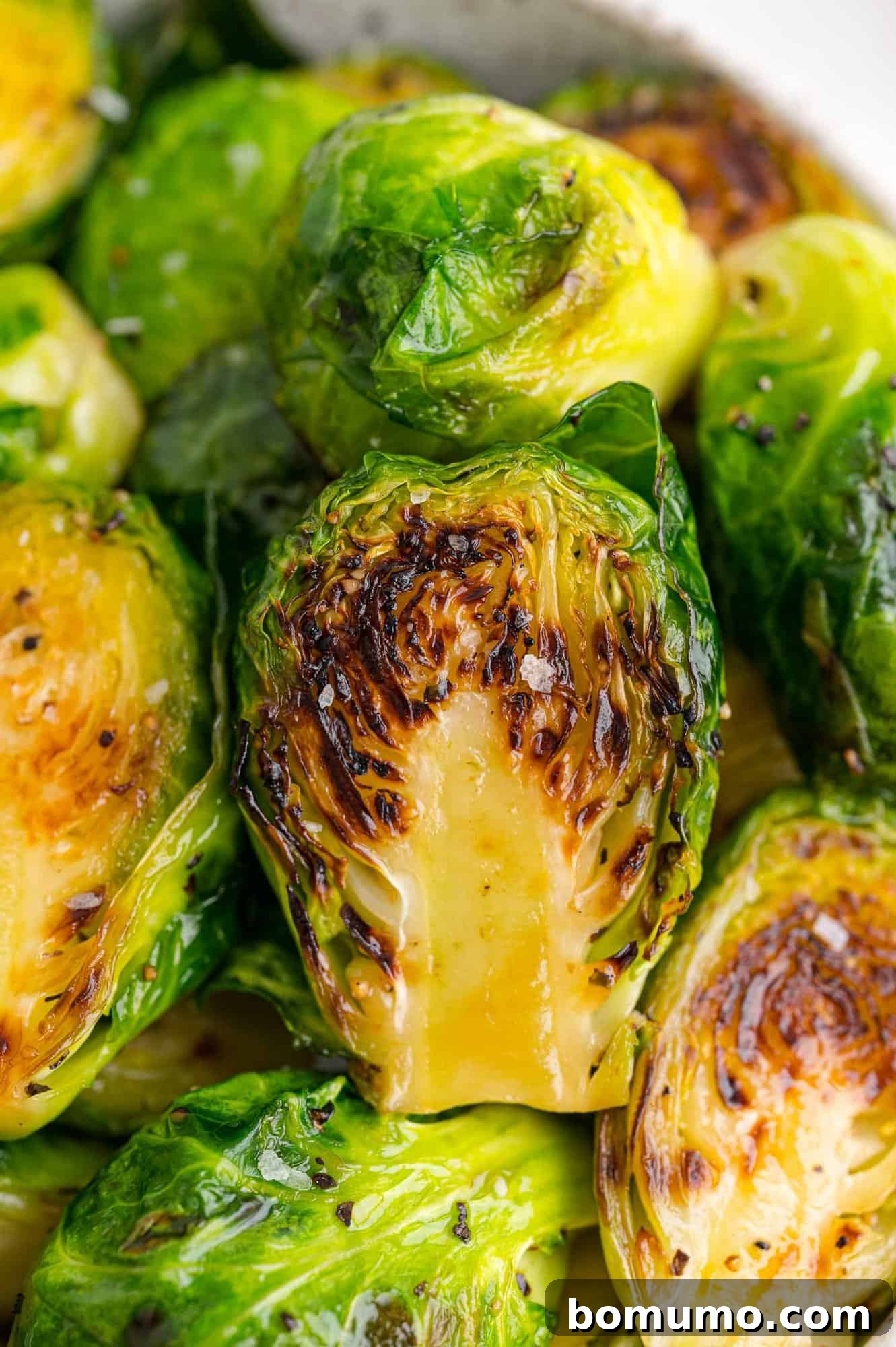 Close up of perfectly sautéed Brussels sprouts.