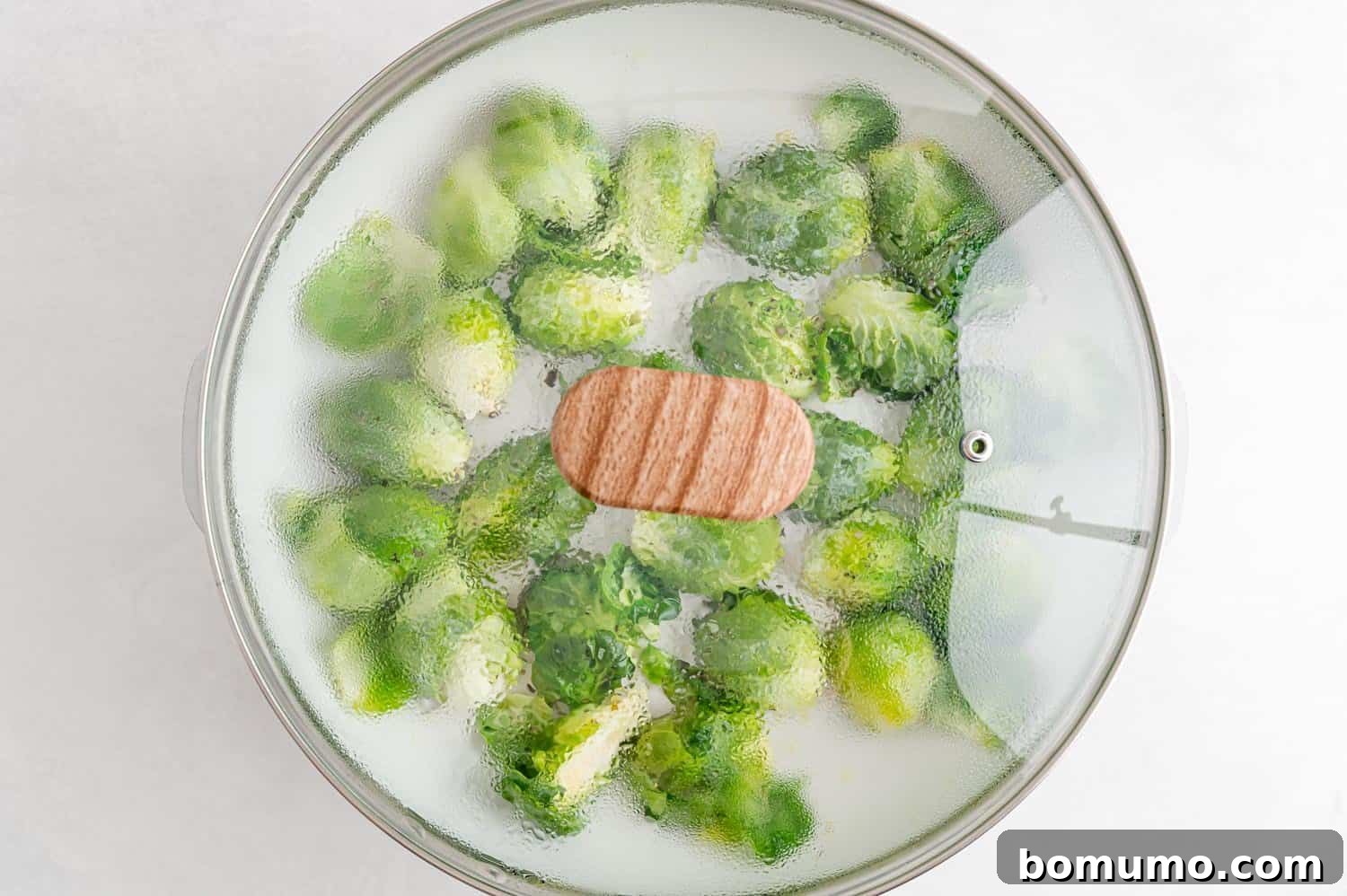 Covered pan of Brussels sprouts.