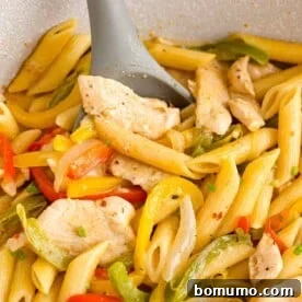 Rasta past in pan - penne pasta, peppers, and spices.