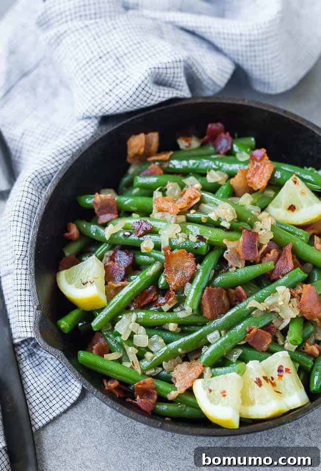 A match made in heaven, these green beans with bacon are completely irresistible. They very well might be your new favorite green bean recipe! 