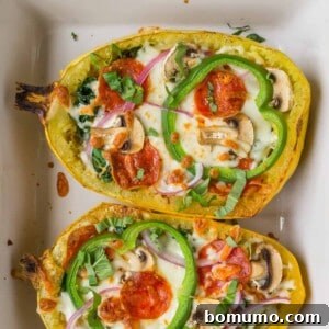 Pizza stuffed spaghetti squash with cheese, pepperoni, and vegetables.
