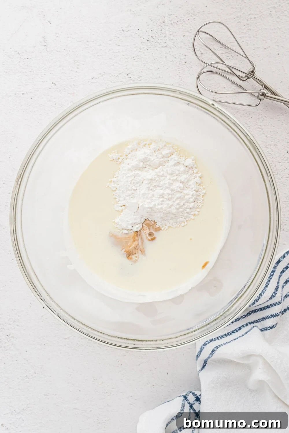 Ingredients in a bowl, not yet mixed, ready for whipping.