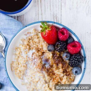 Image of instant pot steel cut oats topped with brown sugar, cinnamon, and fresh berries.