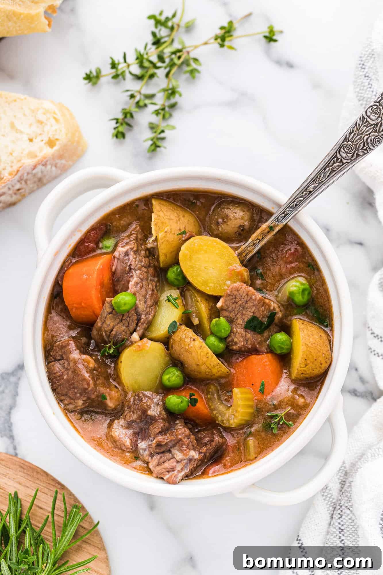 A warm, inviting bowl of crockpot beef stew, perfectly garnished and ready to be enjoyed.