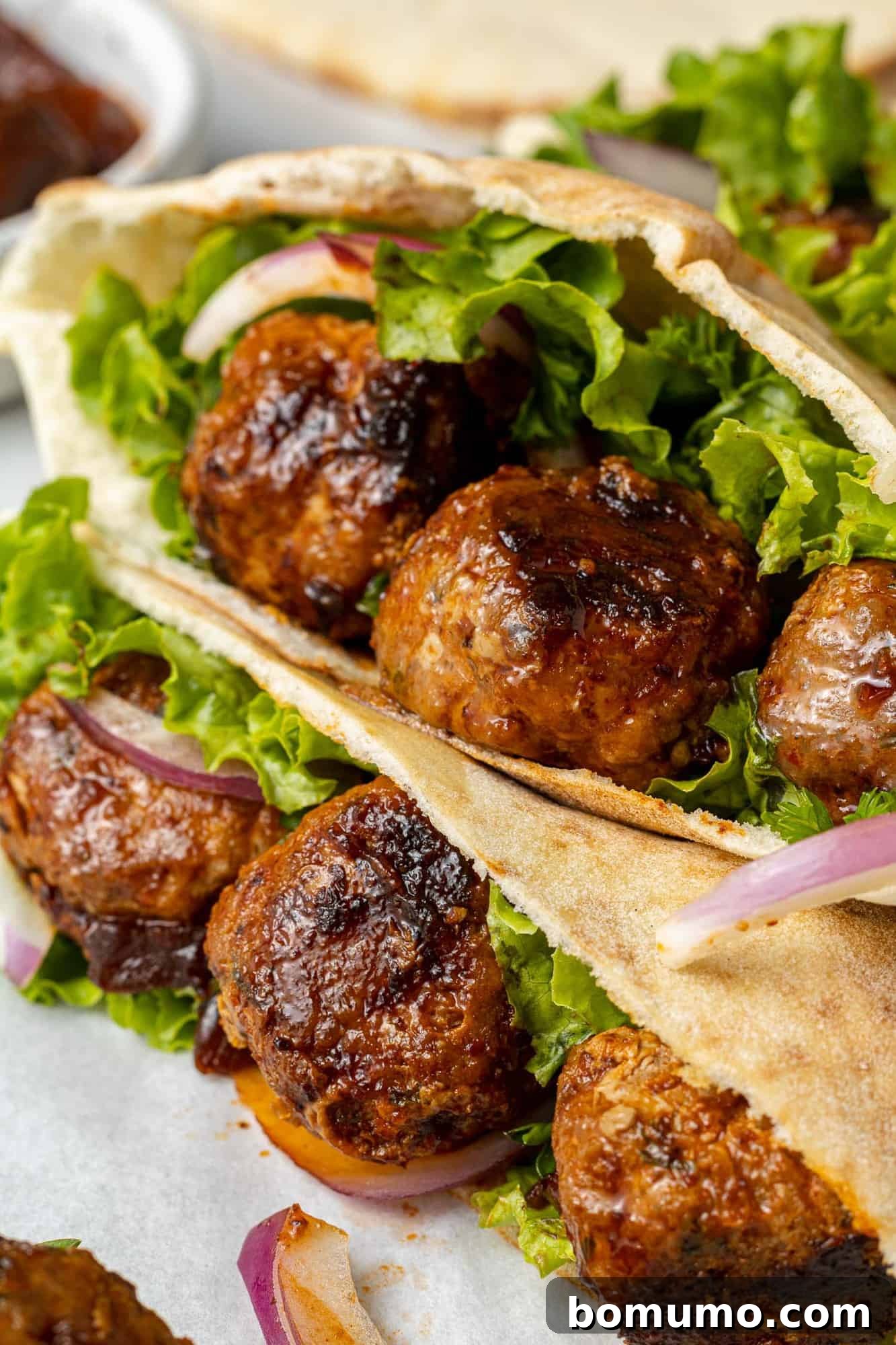 Chipotle glazed meatballs in a pita.
