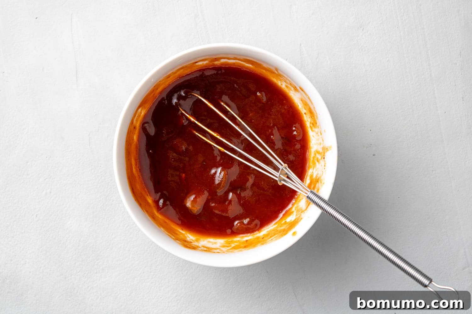 Sauce in a small white bowl.