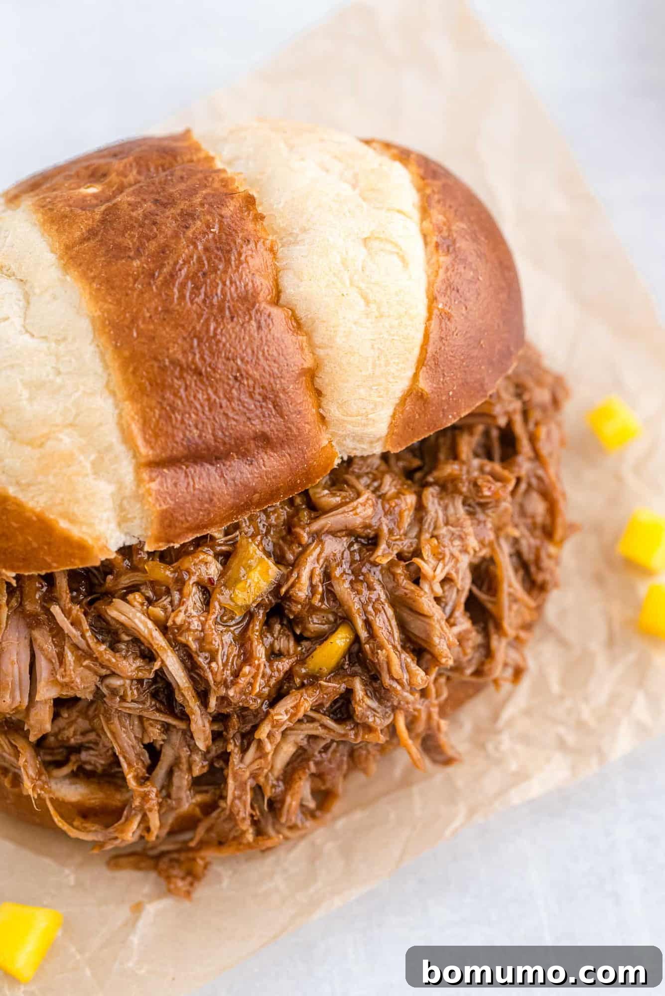 BBQ pulled pork on a pretzel bun.