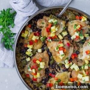 Overhead view of cuban chicken and rice, still in pan.