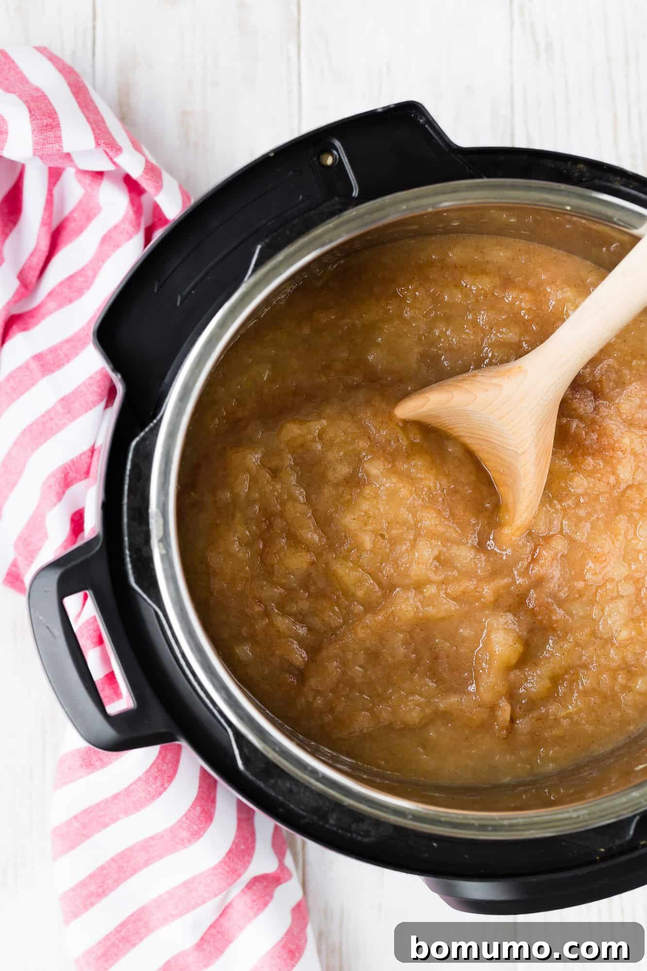 Simple Instant Pot Applesauce 3 Instant Pot filled with freshly cooked applesauce before mashing, showing the tender apple chunks.