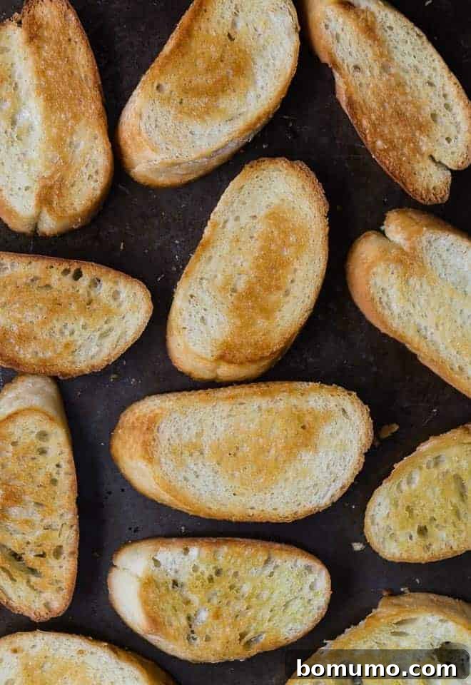Crafting Perfect Crostini 3 A baking sheet filled with perfectly baked crostini, golden brown and ready for toppings.