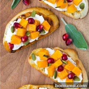 Image of butternut squash crostini topped with pomegranate and pepitas.
