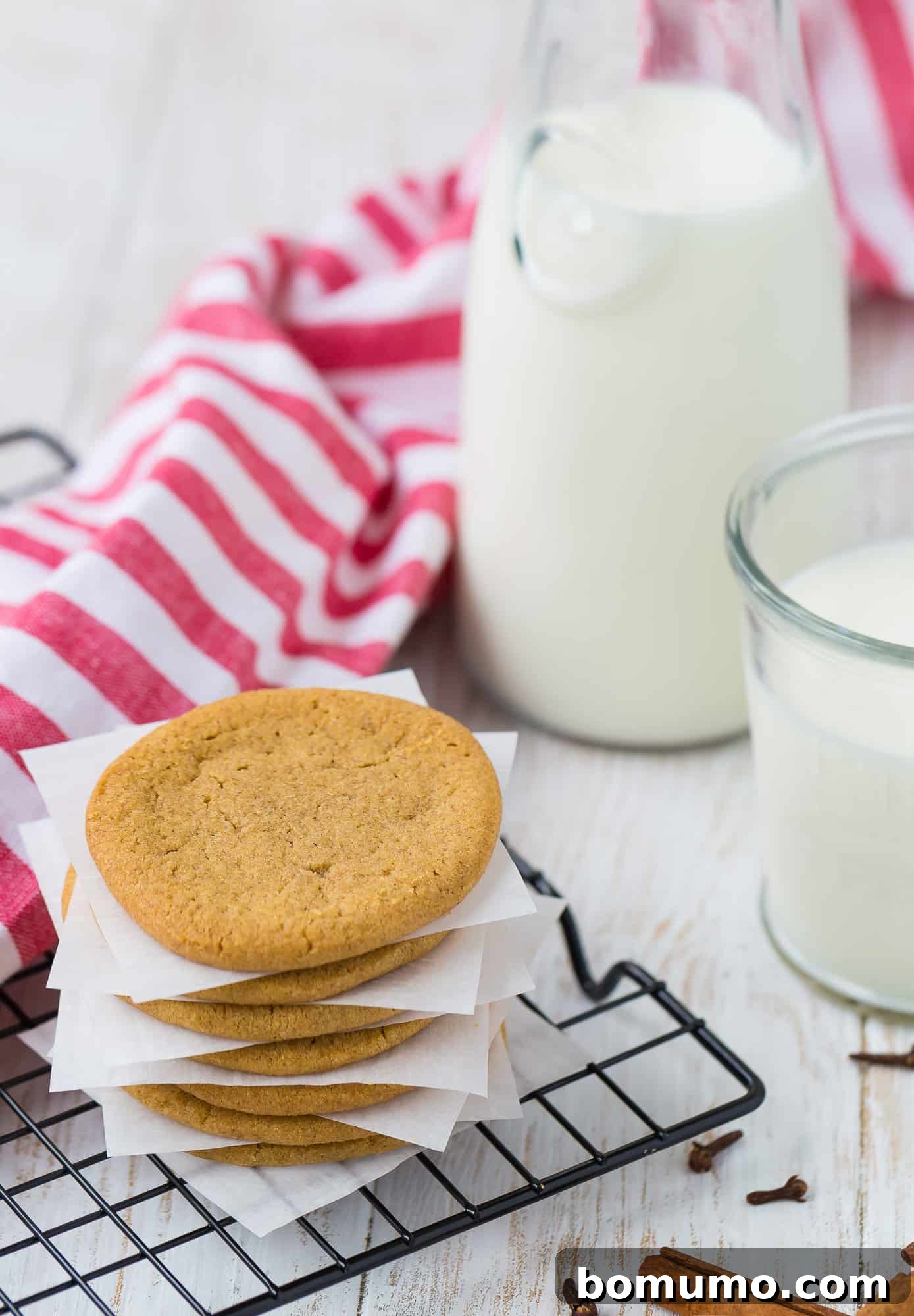 Crisp Windmill Cookies arranged artfully against a soft linen background, emphasizing their golden-brown color and delicate texture, ready to be enjoyed.